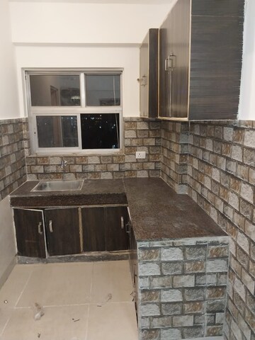 Kitchen in 2 BHK Apartment at Unitech Uniworld Resorts-The Residences, Sector 33 – for Sale