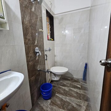 Bathroom in 1 BHK Apartment at Kaustubh Sun Moon CHS Ltd Bldg 12, Datta Pada – for Sale
