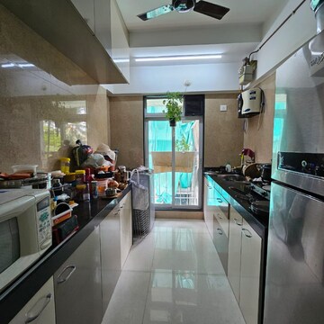 Kitchen in 1 BHK Apartment at Kaustubh Sun Moon CHS Ltd Bldg 12, Datta Pada – for Sale