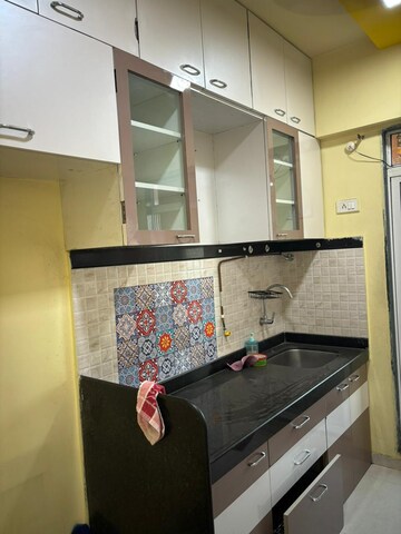 Kitchen in 1 BHK Apartment at Mahavir Kalpavruksha, Ghodbunder Road – for Sale