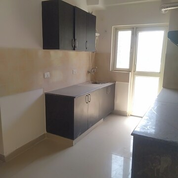 Kitchen in 3.5 BHK Apartment at Aims Golf City, Sector 75 – for Sale