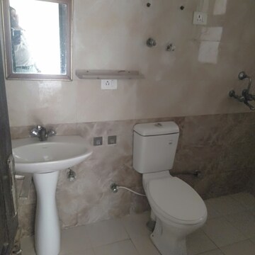 Bathroom in 3.5 BHK Apartment at Aims Golf City, Sector 75 – for Sale