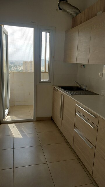 Kitchen in 2 BHK Apartment at Bhartiya Nikoo Homes Phase 2, Thanisandra Main Road – for Sale