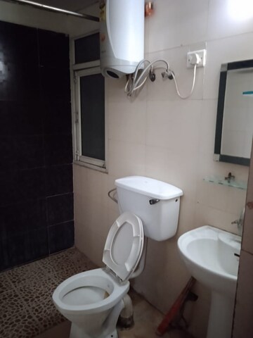 Bathroom in 3 BHK Apartment at Mahagun Mascot, Sain Vihar – for Sale