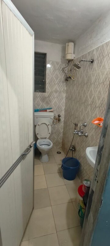Bathroom in 2 BHK Apartment at Kanchan Junga Tower, Kopar Khairane – for Sale