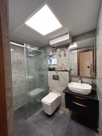 Bathroom in 4 BHK Apartment at Sikka Kaamna Greens, Sector 143a Noida – for Sale