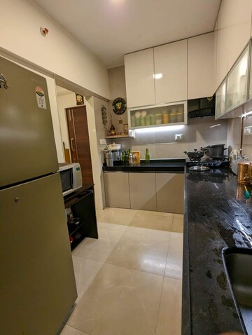 Kitchen in 2 BHK Apartment at Paradigm Ananda Residency, Borivali West – for Sale