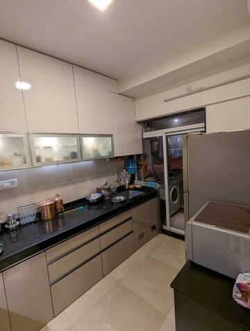 Kitchen in 2 BHK Apartment at Paradigm Ananda Residency, Borivali West – for Sale