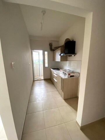 Kitchen in 1 BHK Apartment at Bhartiya Nikoo Homes, Thanisandra Main Road – for Sale