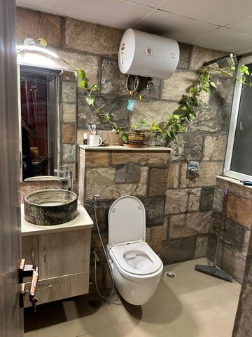 Bathroom in 4 BHK Apartment at Orchid Petals, Sector 49 – for Sale