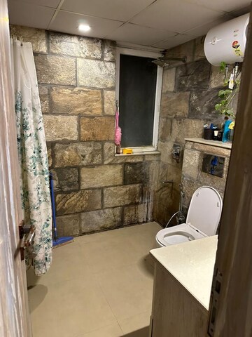 Bathroom in 4 BHK Apartment at Orchid Petals, Sector 49 – for Sale