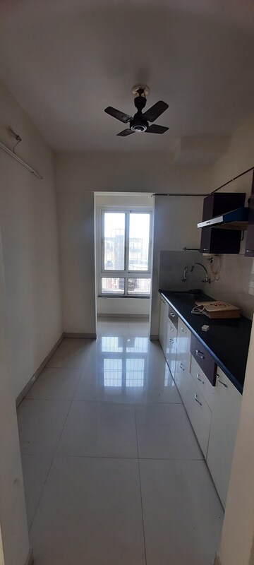 Kitchen in 2.5 BHK Apartment at Puranik Rumah Bali, Ghodbunder Road – for Sale