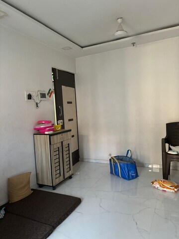 Living Room in 1 BHK Apartment at N G Tivoli RNA, Mira Road – for Sale
