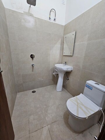 Bathroom in 3 BHK Apartment at Dhakoli Village – for Sale