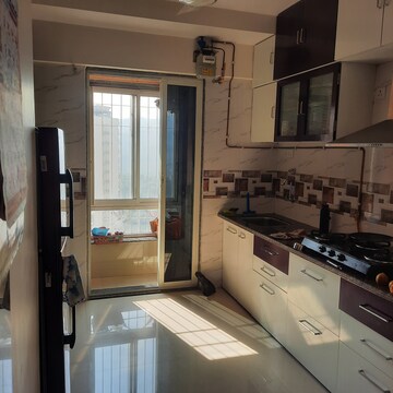 Kitchen in 2 BHK Apartment at Puranik Rumah Bali, Ghodbunder Road – for Sale