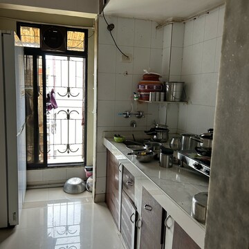 Kitchen in 3 BHK Apartment at Happy Home Estate, Sector 10 – for Sale