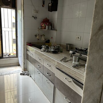 Kitchen in 3 BHK Apartment at Happy Home Estate, Sector 10 – for Sale