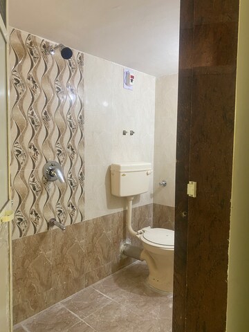 Bathroom in 3 BHK Apartment at Umiya Nakshatra, Katrap – for Sale