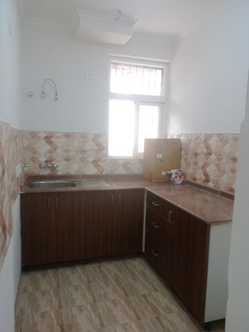 Kitchen in 2 BHK Apartment at Amrapali Leisure Valley – for Sale