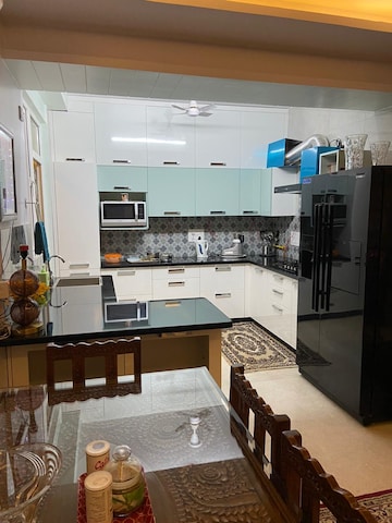 Kitchen in 2 BHK Apartment at RWA Jalvayu Vihar, Sector 25 – for Sale