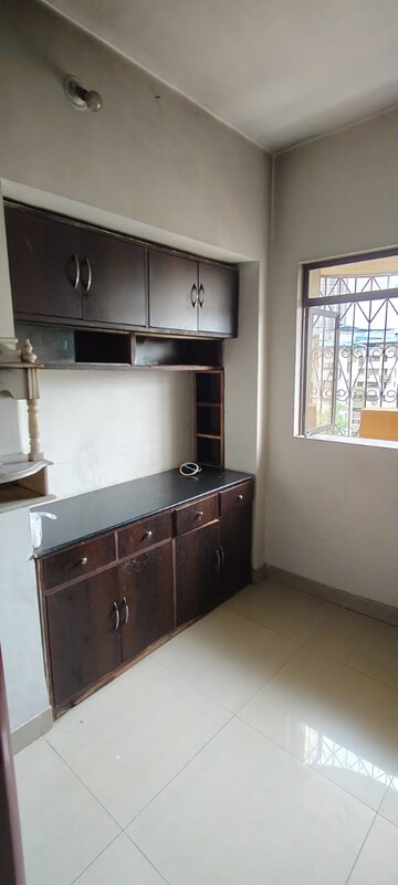 Kitchen in 2.5 BHK Apartment at Garden Court, Waghbil – for Sale