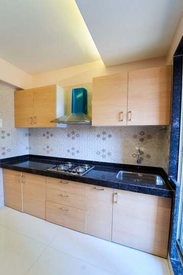Kitchen in 1 BHK Apartment at Tharwani Meghna Montana, Ambernath West – for Sale