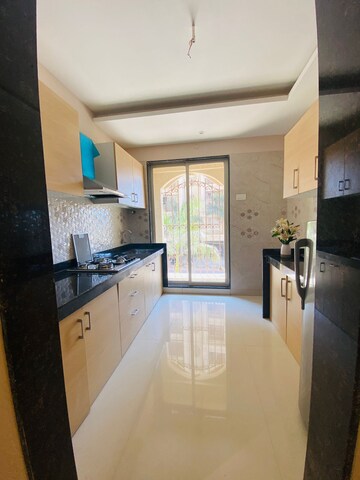 Kitchen in 2 BHK Apartment at Tharwani Meghna Montana, Ambernath West – for Sale