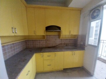 Kitchen in 2.5 BHK Apartment at Mahagun Mywoods II, Sector 16c Greater Noida – for Sale