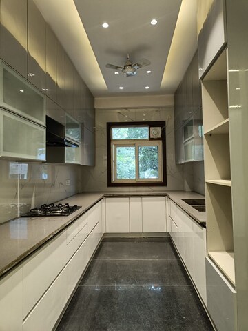 Kitchen in 4 BHK Builder Floor at Vipul Square, Sushant Lok I – for Sale