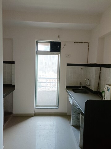 Kitchen in 1 BHK Apartment at Mahavir Kalpavruksha, Ghodbunder Road – for Sale