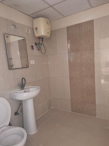 Bathroom in 2 BHK Apartment at Aims Golf City, Sector 75 – for Sale