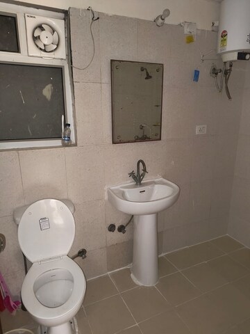 Bathroom in 2 BHK Apartment at Aims Golf City, Sector 75 – for Sale
