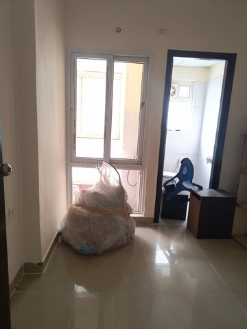 Living Room in 2 BHK Apartment at Aims Golf City, Sector 75 – for Sale