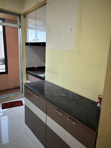 Kitchen in 1 BHK Apartment at Damji Shamji Mahavir Kalpavruksha Wing J Phase 2, Kasarvadavali – for Sale