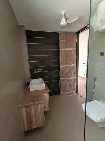 Bathroom in 3.5 BHK Apartment at Ambience Island Lagoon, Sector 24 – for Sale