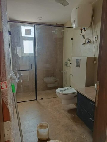 Bathroom in 3.5 BHK Apartment at Ambience Island Lagoon, Sector 24 – for Sale