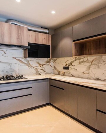 Kitchen in 4 BHK Apartment at Ambience Island Lagoon, Sector 24 – for Sale