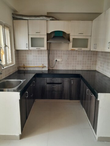 Kitchen in 2.5 BHK Apartment at Amrapali Princely Estate, Sector 76 – for Sale