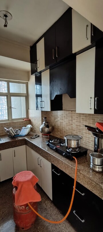 Kitchen in 1 BHK Apartment at Raheja Sampada, Sector 92 – for Sale