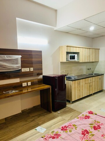 Kitchen in 1 RK Apartment at Paramount Golf Forest Studio Apartments Phase 2 -, Upsidc Site C – for Rent