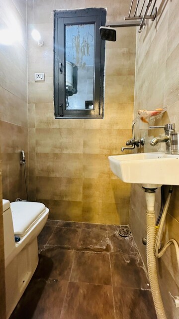 Bathroom in 2 BHK Builder Floor at Chattarpur – for Sale