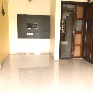 Living Room in 1 BHK Apartment at Dahiwali CHS, Kandarpada – for Sale