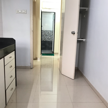 Kitchen in 1 BHK Apartment at Dahiwali CHS, Kandarpada – for Sale