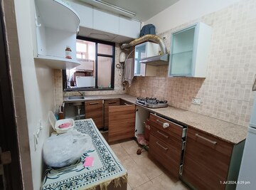 Kitchen in 2 BHK Apartment at Eros Kenwood Tower, Charmwood Village – for Sale