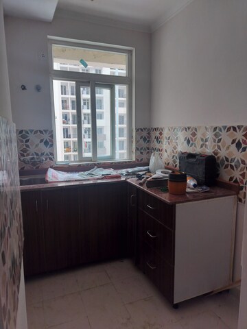 Kitchen in 2 BHK Apartment at Amrapali Leisure Park, Amrapali Leisure Valley – for Sale
