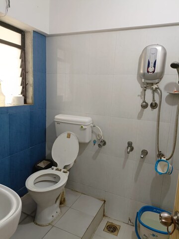 Bathroom in 2 BHK Apartment at Unnati Woods CHS, Kasarvadavali – for Sale