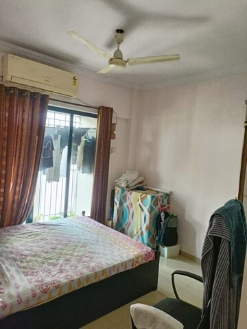 Bedroom in 2 BHK Apartment at Unnati Woods CHS, Kasarvadavali – for Sale