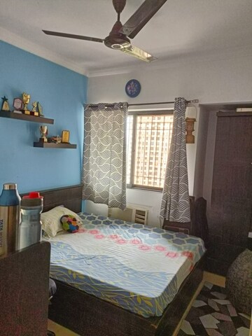 Bedroom in 2 BHK Apartment at Unnati Woods CHS, Kasarvadavali – for Sale