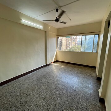 Living Room in 1 BHK Apartment at Shiv Darshan CHS Borivali, Konkani Pada – for Sale