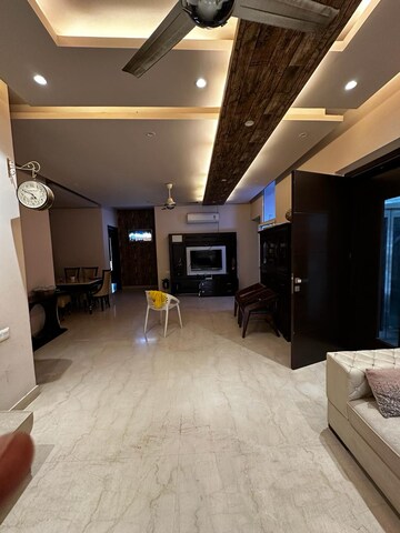 Living Room in 4 BHK Apartment at Tata Raheja Raisina Residency, Sector 59 – for Sale